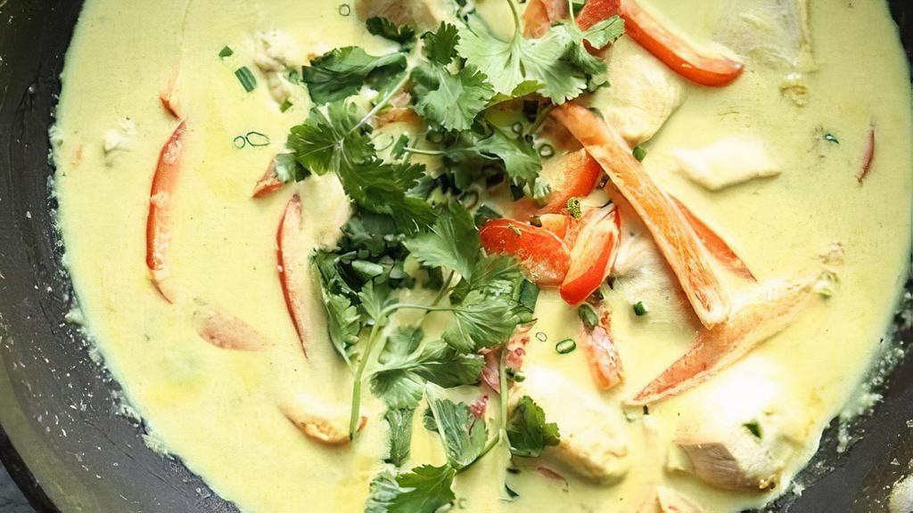 Green Curry (W/ Rice) · Green curry with coconut milk, bamboo shoot, . bell pepper, eggplant, green beans & basil.