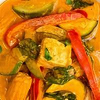 Red Curry ( W/ Rice) · Red curry with coconut milk, bamboo shoot, . bell pepper, eggplant, green beans & basil.