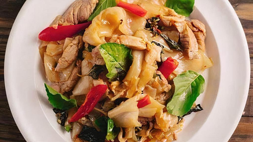 Pad Kee Mao (Drunken Noodle) · Choice of meat; Pan-fried flat noodles, green beans, onion, snow peas, red bell peppers, basil, and garlic chili sauce