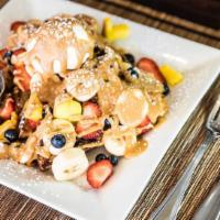 Bru'S Toast · With strawberries, bananas, blueberries, mango, peanut butter, and fresh whipped cream on a ...