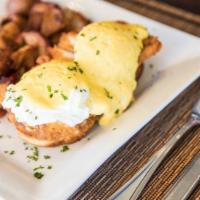 Eggs Benedict · Smoked salmon, crispy chicken or canadian bacon on mini waffles. Served with breakfast potat...