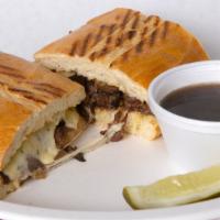 Prime Rib Dip Sandwich · Thin Sliced Prime Rib Cooked in Au Jus, with Melted Havarti Horseradish Cheese, on a Toasted...