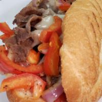 Philly Cheese Steak Sandwich · Thinly sliced steak grilled with bell peppers and onions topped with provolone cheese served...