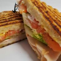 Turkey Melt · Grilled oven-roasted turkey with melted provolone cheese, lettuce, tomato, onions, mustard, ...
