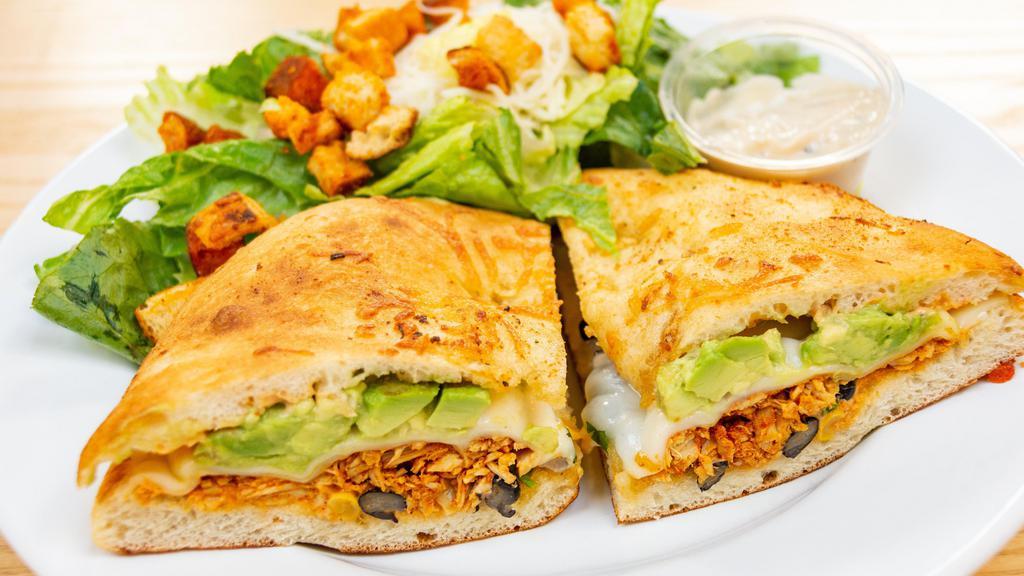 Spicy Chicken Sandwich · Spicy chicken breast, provolone cheese, chipotle mayonnaise, black bean, and corn salsa, and avocados.