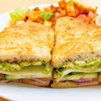 Garden Vegetable Sandwich · Lettuce, Roma tomatoes, provolone cheese, red onions, avocados, cucumbers, and balsamic dres...