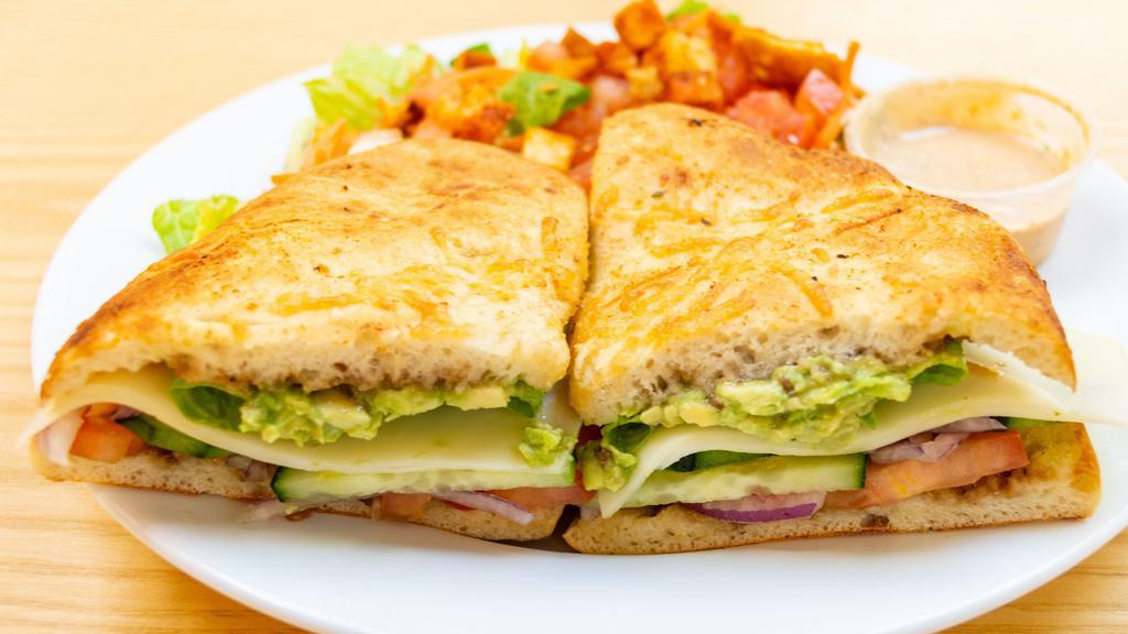 Garden Vegetable Sandwich · Lettuce, Roma tomatoes, provolone cheese, red onions, avocados, cucumbers, and balsamic dressing.