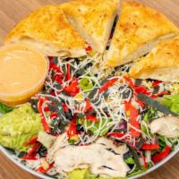 Southwest Chicken Caesar Salad · Iceberg lettuce, grilled chicken breast, spicy caesar dressing, avocados, black bean, and co...