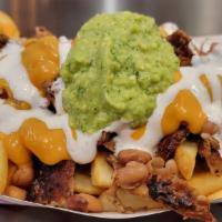 Fries · Choice of meat, pinto beans, nacho cheese, sour cream and guacamole.