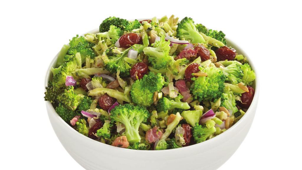 Broccoli Salad · Broccoli, golden raisins, roasted sunflower seeds, red cabbage, carrots, red onion, and bacon tossed with a lemon dressing.