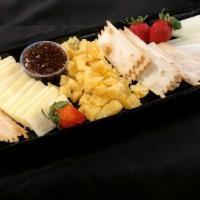 Frutta E Formaggio · Aged Gouda cheese, Canadian cheddar cheese, manchego cheese, fig spread, crackers, and mixed...