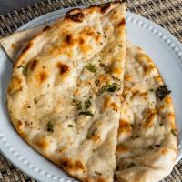 Garlic Naan · Delicious unleavened white bread cooked with garlic and coriander.