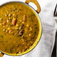 Dal Makhni · Traditional black lentils cooked with fresh herbs, spices, sautéed in butter.