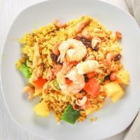 Pineapple Fried Rice · Yellow curry powder with shrimp, chicken, raisins, cashew nuts, bell peppers, onions, and pi...