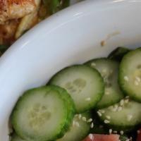 Yellowfin Tuna Salad · Raw tuna marinated Asian spicy sauce, cucumbers, avocado, red onions, sesame seed & ranch dr...