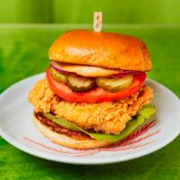 Fried Chicken Sandwich · Crispy chicken breast with tomato, lettuce, onion, pickles, and house sauce.