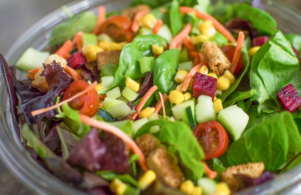American Bounty · Spring mix, spinach, cucumber, tomato, roasted corn, beets, carrot, celery, and croutons. Chef suggests Greens Up! House Balsamic Vinaigrette.