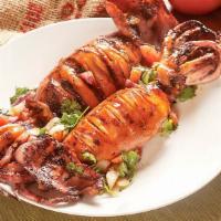 Grilled Jumbo Squid (Each) · Jumbo squid  marinated with house recipe seafood sauce  then grilled just right. Stuffed wit...