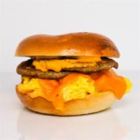 Bagel, Sausage, Egg, & Cheddar · 2 scrambled eggs, melted Cheddar cheese, breakfast sausage, and Sriracha aioli on a toasted ...