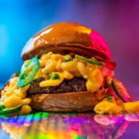 Dirty Mac Burger · 6oz signature burger patty, cheddar mac n cheese, jalapeno, bacon, brioche bun. Served medium.