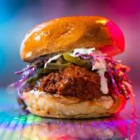 Buffalo Chicken Sandwich · country fried chicken breast tossed in buffalo sauce, slaw, lemon-herb mayo, pickles, brioch...