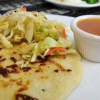 Pupusa De Chicharron · Chicharron y queso. Thick tortilla stuffed with  well cooked pork and  cheese.