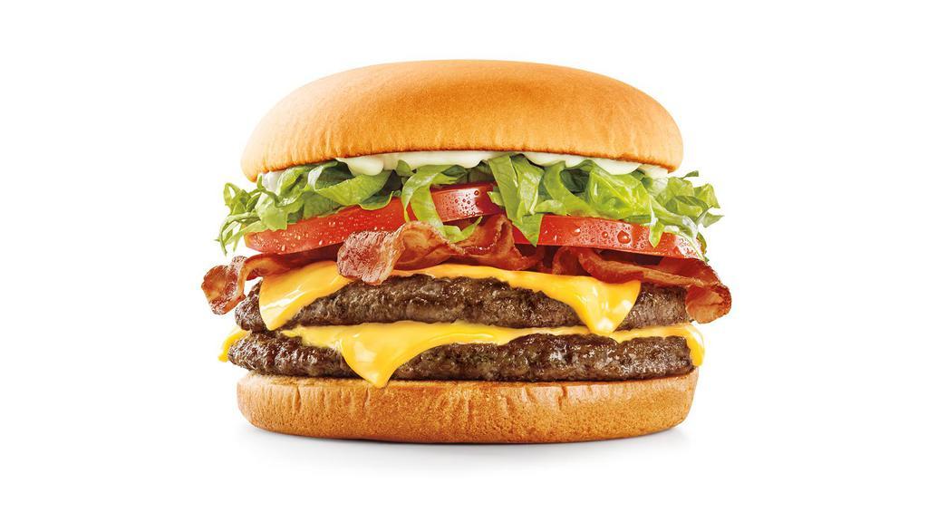 Supersonic Bacon Double Cheeseburger · We start with two quarter-pound, 100% pure beef hamburgers, two melty slices of American cheese, lettuce, fresh sliced tomatoes, creamy mayo, and top it all off with crispy bacon.