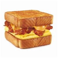 Bacon Cheeseburger Toaster · Cheese, Bacon, Onion Ring, Hickory BBQ, Lettuce, Tomato, Pickle, onions on Texas Toast