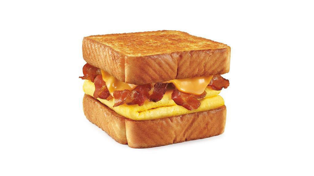 Bacon Cheeseburger Toaster · Cheese, Bacon, Onion Ring, Hickory BBQ, Lettuce, Tomato, Pickle, onions on Texas Toast