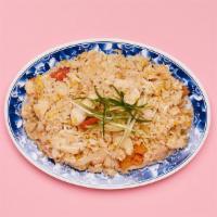 Shrimp Thai Fried Rice · Wok fried rice tossed with shrimp, tomato, fried egg, and onion.