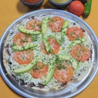 Vegetarian Tlayuda / Tlayuda Vegetariana  · Large handmade tortilla with spreaded refried beans, shredded cabbage, tomato avocado, red s...