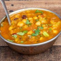 Chana Masala · Chickpeas cooked with special herbs and spices in Taste of Himalayas gravy.