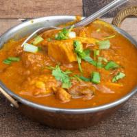 Chicken Curry · Boneless mixed chicken cooked in onion and tomato gravy with Himalayan spices.
