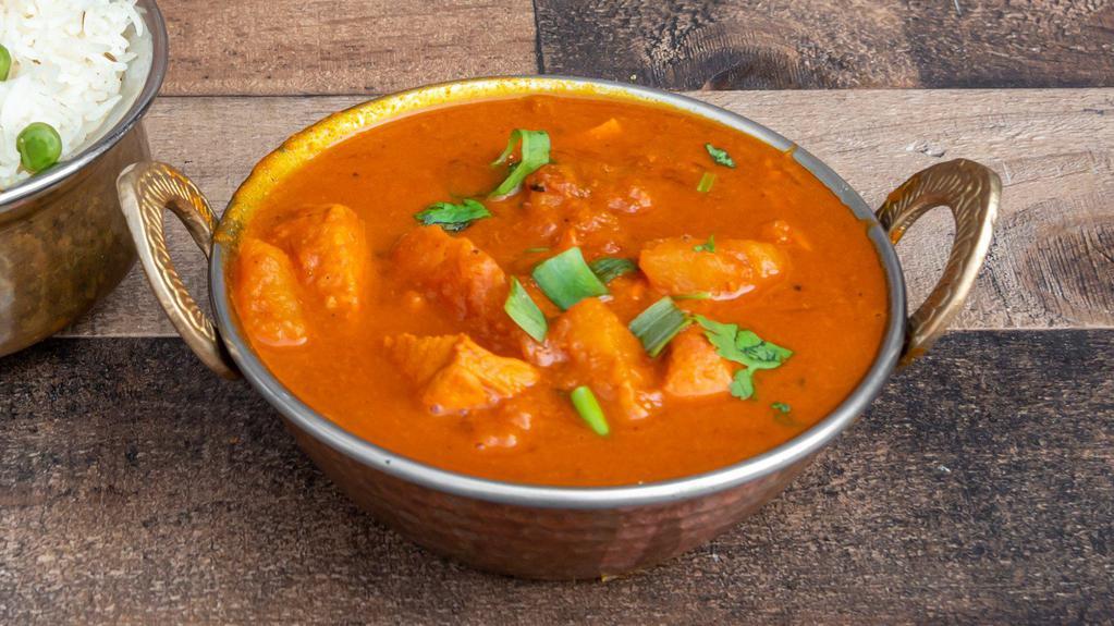 Chicken Vindaloo · Premium chicken cooked with potato & vinegar in Himalayan sauce, herbs, and spices.