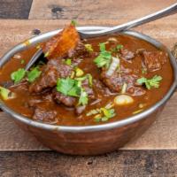 Goat Curry · Meat of goat containing bones part cooked in an especial Himalayan sauce consisting herbs an...