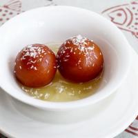 Gulab Jamun · Round fried dough balls dipped in sugar syrup.