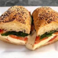 Caprese Sandwich · fresh mozzarella, tomatoes, basil, extra virgin olive oil, balsamic, seeded baguette