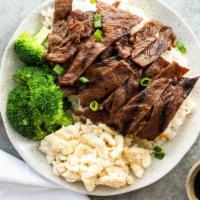 Korean Bbq Beef · Thinly sliced strips of choice angus tri-tip beef marinated in a flavorful, sweet and savory...