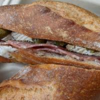 Le Saucisson · Italian dry salami, French brie cheese, European butter and French cornichon pickles.