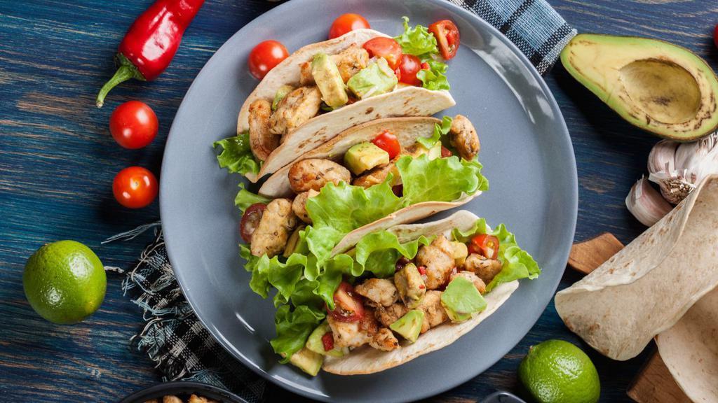 Chicken Tacos · Fresh Taco made with Grilled Chicken, onions, salsa, and cilantro.