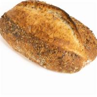 Multigrain Bread · Our multigrain bread is made with honey, sunflower seed, sesame seed, poppy seed and dry figs.