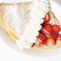 Crêpe Printanière · Fresh strawberries, a berry mix sauce and whipped cream.