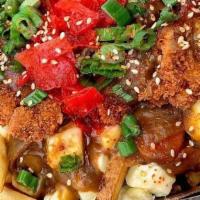 Katsu Curry · Panko-crusted chicken cutlet, housemade Japanese curry gravy, cheese curds, Japanese radish,...
