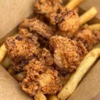 Nugget Box W/Fries · Fried chicken nuggets and french fries with dipping sauce.