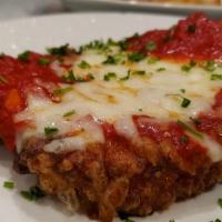 Chicken Parmesan · Breaded chicken breast with marinara sauce and mozzarella cheese served with penne marinara