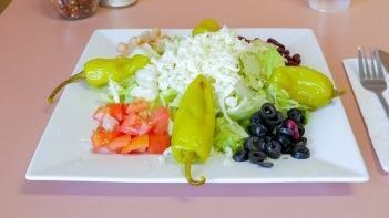 Italian Meattess Salad · Iceberg lettuce, romaine lettuce, kidney beans, garbanzo beans, tomatoes, mozzarella cheese,...