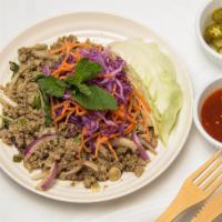 Larb Kai · Minced Chicken Spiced with Lime Juice, Chili, Rice Powder, and Fresh Mint.