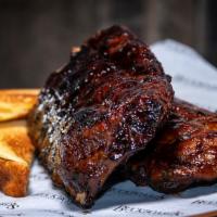 Baby Backs Full · Full Rack of Pork Back Back Ribs Dry Rubbed, Smoked and Slow Roasted with OG BBQ Sauce. We M...