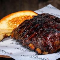 Baby Backs Half · Half Rack of Pork Back Back Ribs Dry Rubbed, Smoked and Slow Roasted with OG BBQ Sauce. We M...