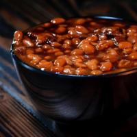 Bbq Baked Beans · Creamy Baked Beans with Pork Belly and Seasoning Topped with OG BBQ Sauce. GF